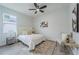 Cozy bedroom with carpet, side table, and modern art at 59 W 10Th St, Apopka, FL 32703
