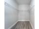Walk-in closet with wire shelving and wood-style floors at 59 W 10Th St, Apopka, FL 32703