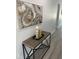 Hallway featuring art and a wooden console table at 59 W 10Th St, Apopka, FL 32703