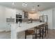 Modern kitchen features sleek white cabinets, stainless steel appliances, and quartz counters at 59 W 10Th St, Apopka, FL 32703