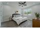 Bright main bedroom with a ceiling fan, a queen bed, and vinyl flooring at 59 W 10Th St, Apopka, FL 32703
