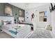 Star Wars themed bedroom with twin beds, movie posters, rug, plush Grogu and TV at 8951 Amelia Downs Trl, Kissimmee, FL 34747