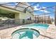 Relaxing private pool and spa area enclosed with a screen and a safety fence at 8951 Amelia Downs Trl, Kissimmee, FL 34747
