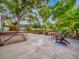 Spacious backyard with a hot tub, outdoor seating, and mature trees offering shade at 1145 Utah Blvd, Orlando, FL 32803