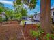 Well-maintained backyard with a spa, manicured landscaping, mature trees, and ample outdoor living space at 1145 Utah Blvd, Orlando, FL 32803