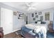 Comfortable bedroom with soft colors, hardwood floors, decorative furnishings, and plenty of natural light at 1145 Utah Blvd, Orlando, FL 32803