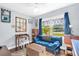 Bright bedroom with large window, desk, comfortable furniture, and natural light at 1145 Utah Blvd, Orlando, FL 32803