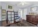 Bedroom featuring a dresser, hardwood floors, and storage shelves at 1145 Utah Blvd, Orlando, FL 32803