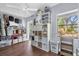 Bonus room with plenty of storage, a ceiling fan, wood floors, and a large window at 1145 Utah Blvd, Orlando, FL 32803