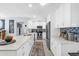 Modern kitchen with white cabinets, stainless steel appliances, and tiled backsplash at 1145 Utah Blvd, Orlando, FL 32803