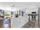 Spacious kitchen with a large island, white cabinetry, stainless appliances, and eat in dining space at 1145 Utah Blvd, Orlando, FL 32803
