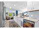 Bright kitchen with white cabinets, stainless steel appliances, and views to the living room at 1145 Utah Blvd, Orlando, FL 32803