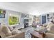 Spacious living room with sofas, hardwood floors, and a large window providing ample natural light at 1145 Utah Blvd, Orlando, FL 32803