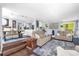 Open-concept living room with dining area, hardwood floors, and comfortable seating for entertaining at 1145 Utah Blvd, Orlando, FL 32803