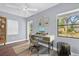 Bright home office with a desk, chair, modern decor, and a large window with a tree view at 1145 Utah Blvd, Orlando, FL 32803