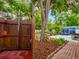 Outdoor shower near backyard patio and mature trees, offering a unique and refreshing experience at 1145 Utah Blvd, Orlando, FL 32803