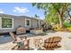 Outdoor patio featuring a hot tub, seating, grill, and a serene backyard setting at 1145 Utah Blvd, Orlando, FL 32803