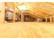View of the unfinished attic featuring insulation and structural elements at 1312 7Th St, St Cloud, FL 34769