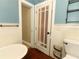 Bright bathroom featuring a toilet, bathtub, and decorative wall accents at 1312 7Th St, St Cloud, FL 34769