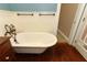 Close-up of a luxurious clawfoot tub with vintage-style faucet and fixtures at 1312 7Th St, St Cloud, FL 34769