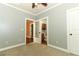 Bedroom leading to an adjacent room and bathroom with wood style floors at 1312 7Th St, St Cloud, FL 34769