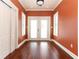 Bright bonus room with white doors and warm toned floors at 1312 7Th St, St Cloud, FL 34769