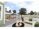 Back deck with seating, outdoor dining area, and a fire pit, perfect for gatherings at 1312 7Th St, St Cloud, FL 34769
