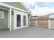 Deck features a wooden fence and double glass doors to the house at 1312 7Th St, St Cloud, FL 34769