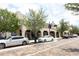 Street view of a historic building with storefronts and parked cars in a charming downtown area at 1312 7Th St, St Cloud, FL 34769