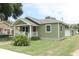 Quaint home with a front porch and a spacious, well-manicured lawn at 1312 7Th St, St Cloud, FL 34769