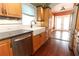 Beautiful kitchen sink and stainless steel appliances are highlighted in this kitchen view at 1312 7Th St, St Cloud, FL 34769