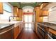 Charming kitchen features wooden cabinets, stainless steel appliances, and hardwood floors at 1312 7Th St, St Cloud, FL 34769