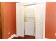 Laundry closet with a stacked washer and dryer, creating a space-saving solution at 1312 7Th St, St Cloud, FL 34769