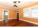 Spacious living room with hardwood floors, and a view of the front door at 1312 7Th St, St Cloud, FL 34769