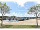 Picturesque marina view with boats docked, framed by trees against a clear sky at 1312 7Th St, St Cloud, FL 34769
