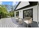 A peaceful seating area with stylish chairs on the back deck offers a relaxing outdoor retreat at 13562 S Lake Mary Jane Rd, Orlando, FL 32832