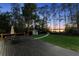 Enjoy this deck with a table and an umbrella in a serene backyard overlooking the picturesque lake at 13562 S Lake Mary Jane Rd, Orlando, FL 32832
