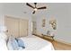 Comfortable bedroom featuring a king-size bed, sliding glass doors to a deck, and ample natural light at 13562 S Lake Mary Jane Rd, Orlando, FL 32832