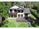 Lovely two-story home featuring a large deck and a charming balcony overlooking the yard at 13562 S Lake Mary Jane Rd, Orlando, FL 32832