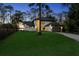Elegant home with a well-manicured lawn and a charming palm tree in the front yard at 13562 S Lake Mary Jane Rd, Orlando, FL 32832