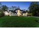Beautifully illuminated home with a spacious front lawn and well-maintained landscaping at 13562 S Lake Mary Jane Rd, Orlando, FL 32832