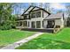 Stunning exterior of a modern home with an expansive backyard and a stone walkway at 13562 S Lake Mary Jane Rd, Orlando, FL 32832