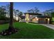 Beautiful two-story home with a well-maintained lawn, manicured flowerbeds, and an attached two-car garage at 13562 S Lake Mary Jane Rd, Orlando, FL 32832