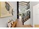Bright foyer showcasing a staircase and fireplace with exposed ceiling beams at 13562 S Lake Mary Jane Rd, Orlando, FL 32832