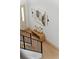 Upstairs view of the foyer featuring a staircase and an abstract art piece hanging on the wall at 13562 S Lake Mary Jane Rd, Orlando, FL 32832