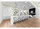 Spacious kitchen with white cabinetry, an island with seating, and stainless steel appliances at 13562 S Lake Mary Jane Rd, Orlando, FL 32832