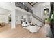 Open-concept living area that features a staircase, fireplace, and a modern kitchen at 13562 S Lake Mary Jane Rd, Orlando, FL 32832