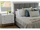Up-close detail showcasing the luxurious bedding and unique dresser with gold hardware at 13562 S Lake Mary Jane Rd, Orlando, FL 32832