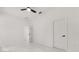 Clean, bright bedroom with tile flooring and a doorway, offering a calm and comfortable atmosphere at 16500 Magnolia Terrace Blvd, Montverde, FL 34756