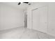Bright bedroom featuring double closet, ceiling fan, and marble floors at 16500 Magnolia Terrace Blvd, Montverde, FL 34756